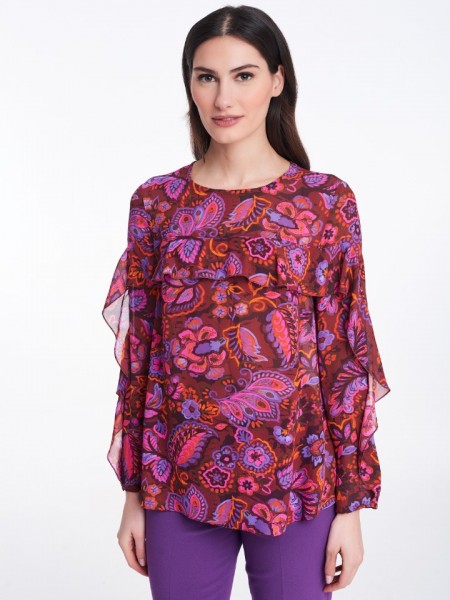 Floral printed φούξια μακρυμάνικη μπλούζα σε χαλαρή γραμμή με κλειστή στρογγυλή λαιμόκοψη, μικρά βολάν στο μπροστά μέρος και στα μανίκια και κλείσιμο με κουμπί ψηλά στην πλάτη Badoo