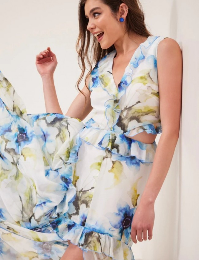 Floral printed λευκό αμάνικο maxi φόρεμα με βολάν σε επίπεδα, ανοίγματα στα πλαϊνά και μπροστινό σκίσιμο  Enzzo