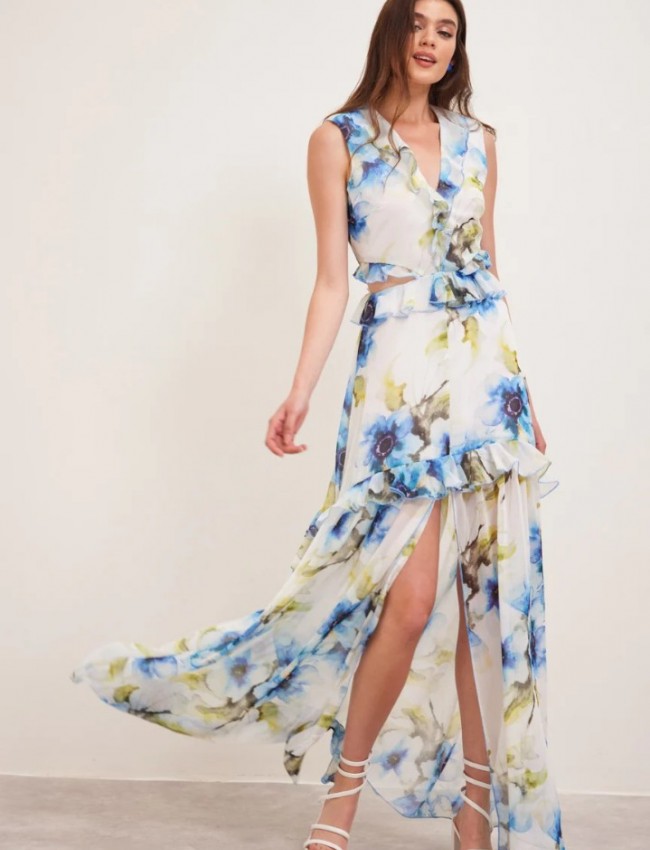 Floral printed λευκό αμάνικο maxi φόρεμα με βολάν σε επίπεδα, ανοίγματα στα πλαϊνά και μπροστινό σκίσιμο  Enzzo