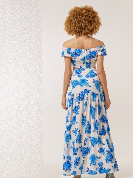Floral printed γαλάζια ψηλόμεση maxi φούστα, με σκίσιμο μπροστά, αποσπώμενο υφασμάτινο λουλούδι και κλείσιμο με κρυφό φερμουάρ στο πλάι Enzzo 