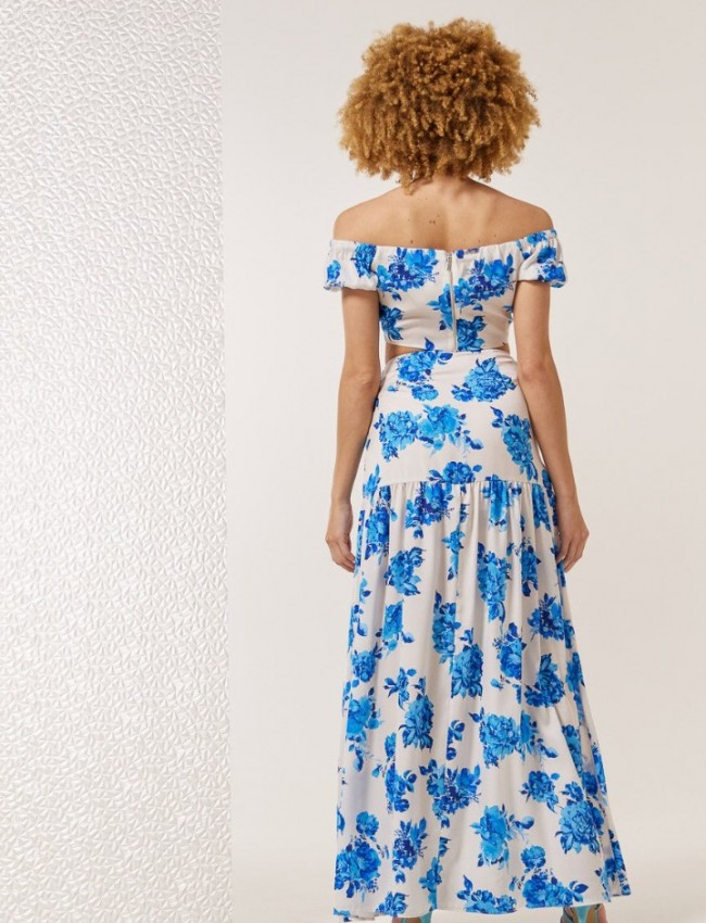 Floral printed γαλάζια ψηλόμεση maxi φούστα, με σκίσιμο μπροστά, αποσπώμενο υφασμάτινο λουλούδι και κλείσιμο με κρυφό φερμουάρ στο πλάι Enzzo 