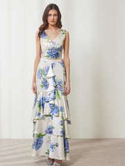 Floral printed μπλε μεταλλιζέ maxi Aubrey φούστα, με βολάν σε επίπεδα, κάθετο βολάν με μπροστινό σκίσιμο, λάστιχο πίσω στην μέση και κλείσιμο με κρυφό φερμουάρ στο πλάι Enzzo  