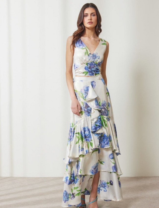 Floral printed μπλε μεταλλιζέ maxi Aubrey φούστα, με βολάν σε επίπεδα, κάθετο βολάν με μπροστινό σκίσιμο, λάστιχο πίσω στην μέση και κλείσιμο με κρυφό φερμουάρ στο πλάι Enzzo  