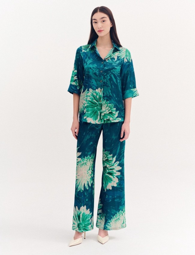 Floral printed πράσινη σατέν ψηλόμεση παντελόνα, σε ίσια γραμμή, με πλαϊνές τσέπες και λάστιχο πίσω στην μέση Forel 