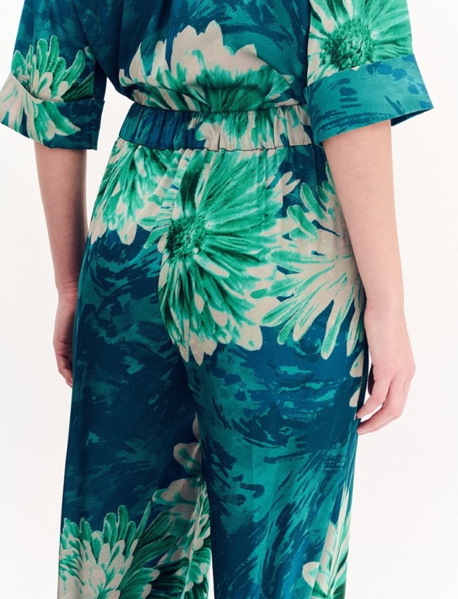 Floral printed πράσινη σατέν ψηλόμεση παντελόνα, σε ίσια γραμμή, με πλαϊνές τσέπες και λάστιχο πίσω στην μέση Forel 