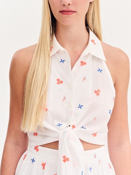Floral printed λευκό αμάνικο πουκάμισο, με πέτο γιακά, παρτούς ώμους κλείσιμο με κουμπιά μπροστά και μη αποσπώμενη ζώνη-δέσιμο Forel Case Study