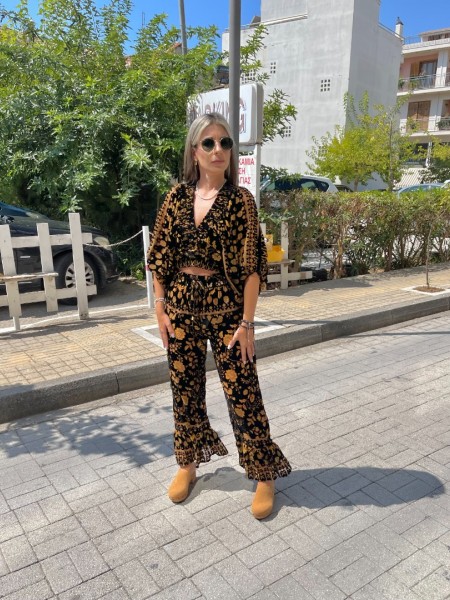 Εμπριμέ μαύρη ψηλόμεση cropped παντελόνα σε flocko ύφανση, λάστιχο στην μέση και μεγάλο βολάν στο τελείωμα Innocent