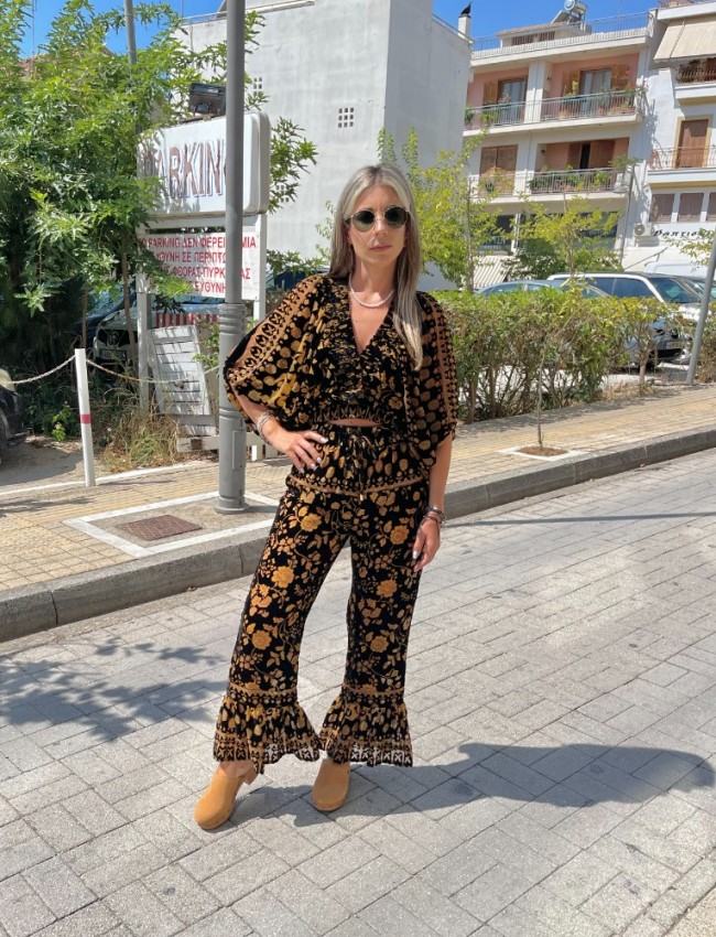 Εμπριμέ μαύρη ψηλόμεση cropped παντελόνα σε flocko ύφανση, λάστιχο στην μέση και μεγάλο βολάν στο τελείωμα Innocent