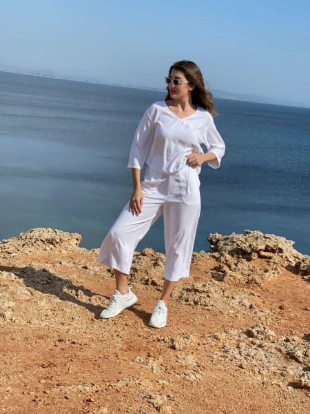 Λευκή ψηλόμεση ζιπ-κιλότ σε tencel ύφασμα, με πιέτες μπροστά, λάστιχο στην μέση και τσέπες στο πλάι Innocent